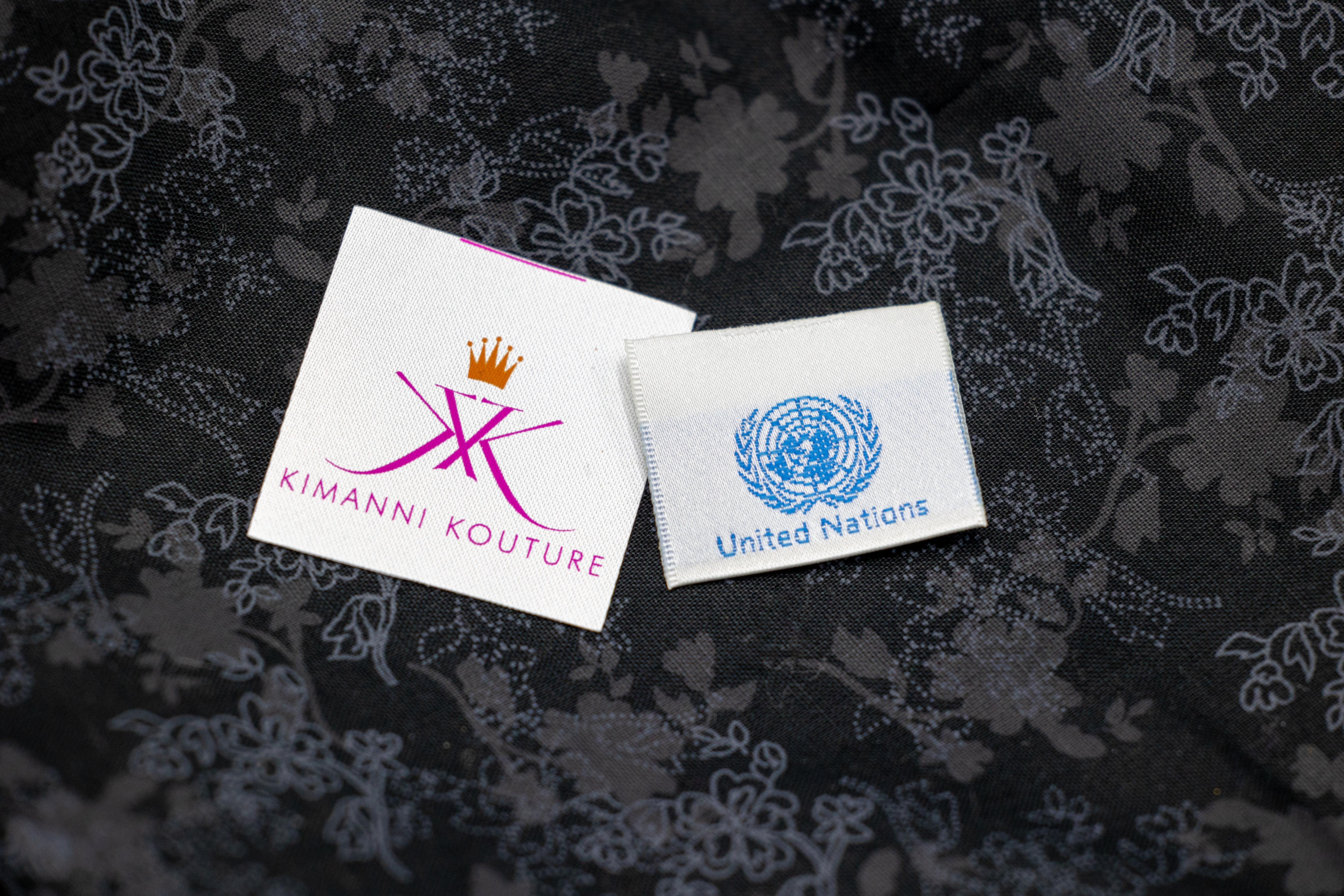 Fabric woven labels vs printed labels comparison showing durability and texture differences for clothing brands