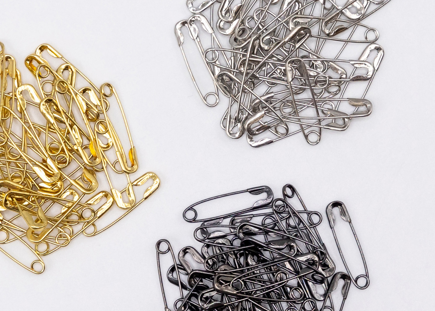 Professional safety pins in bright nickel, brass, and black oxide finishes